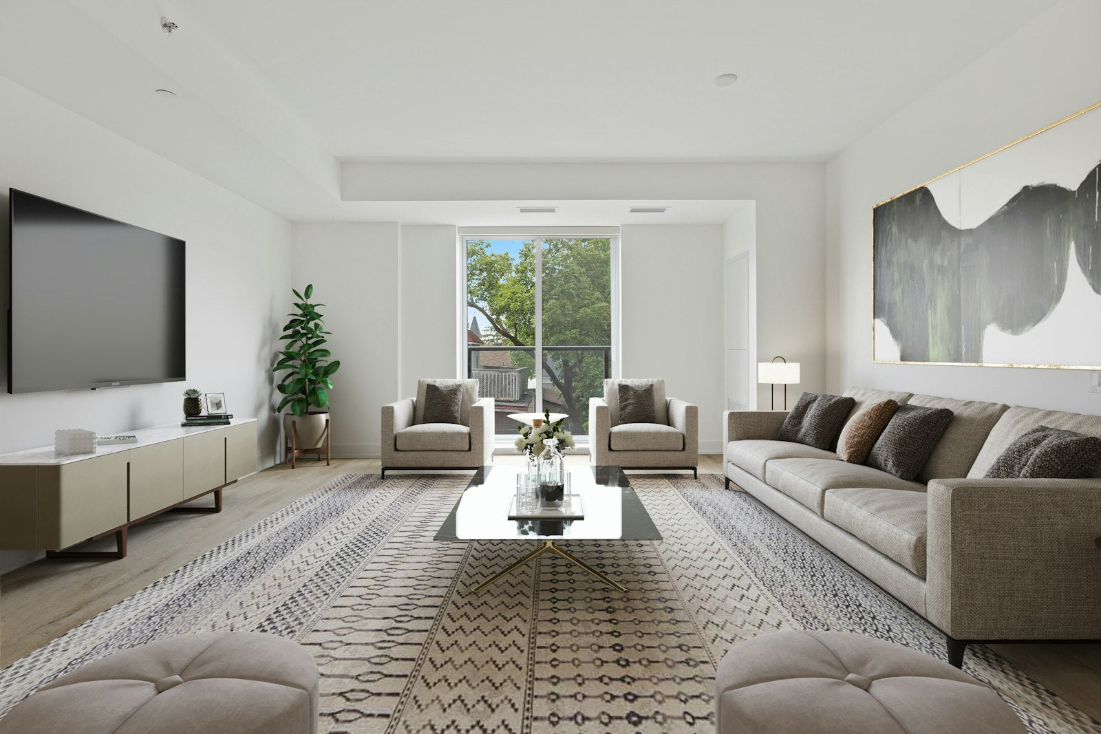 Bright living room arranged around a large neutral area rug